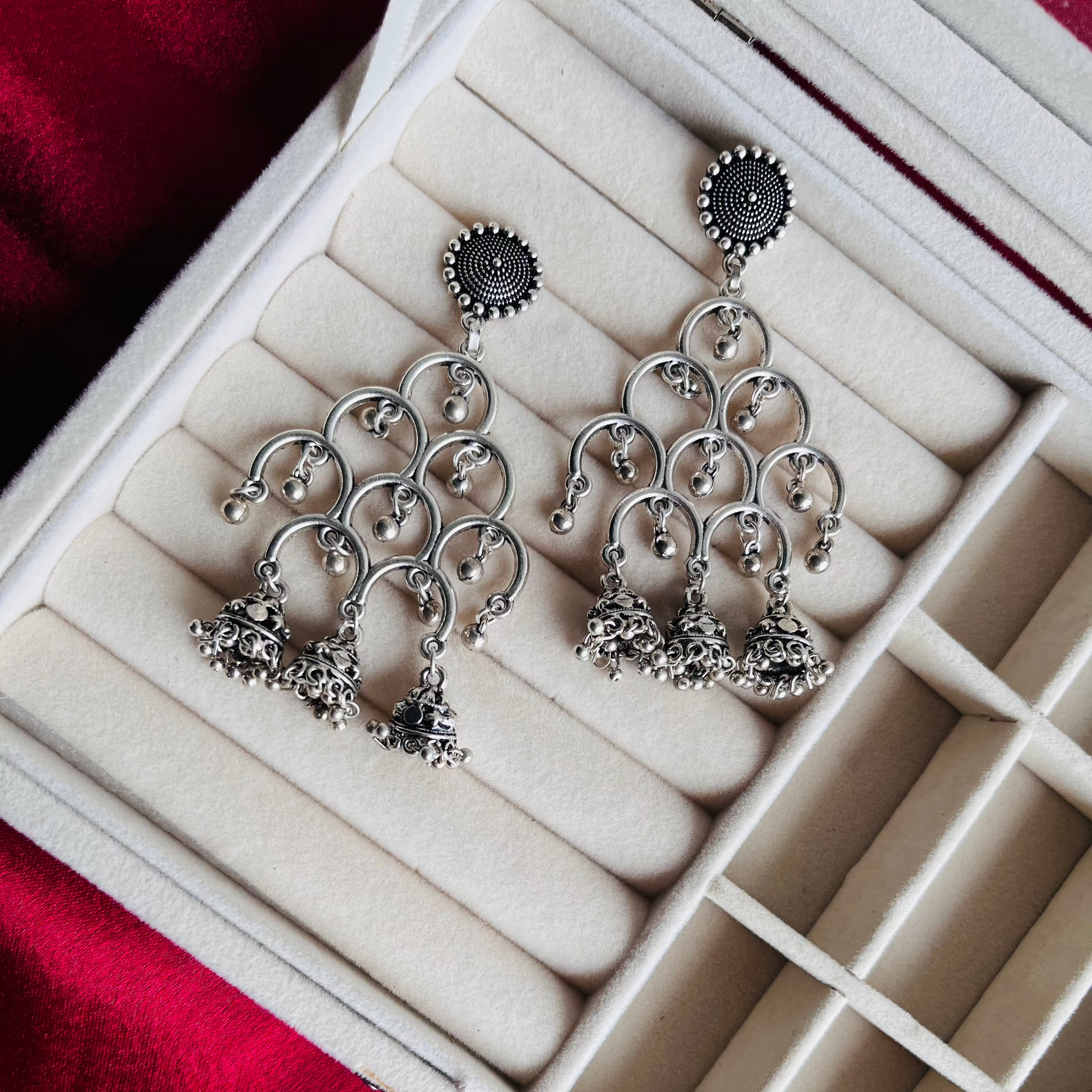 A pair of Diya Earrings featuring intricate oxidized craftsmanship, perfect for festive wear.