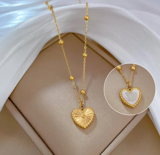 Double-sided heart necklace with a reversible pendant,offering two unique styles in one elegant design.