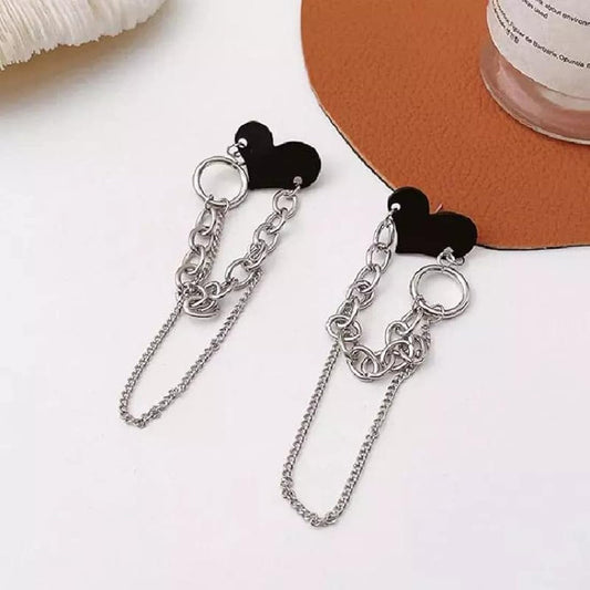 A pair of Heart Chain Earrings featuring delicate heart pendants connected by a sleek chain, inspired by Korean aesthetics.
