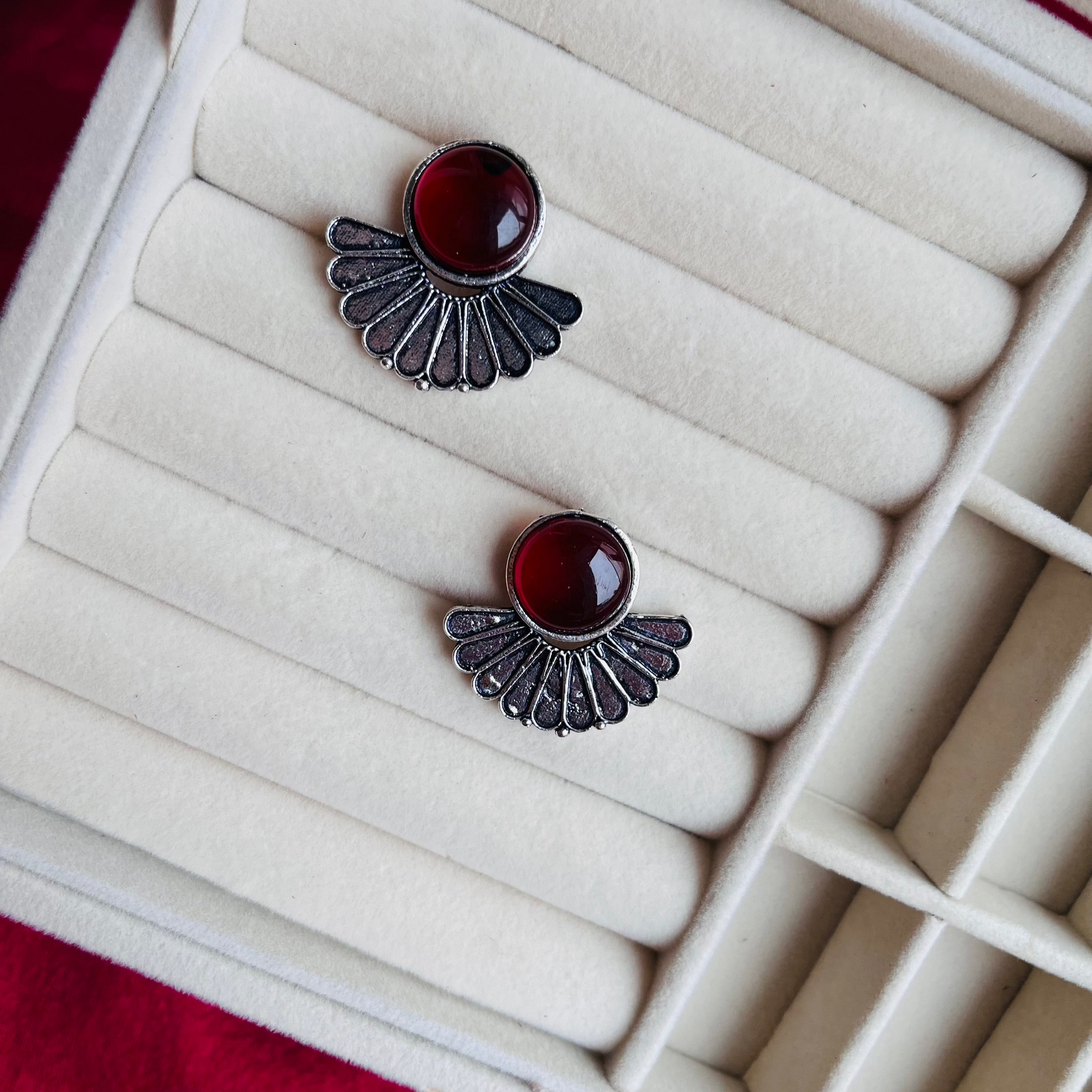 A pair of Sadgi Earrings with a simple yet elegant oxidized design, perfect for everyday wear.