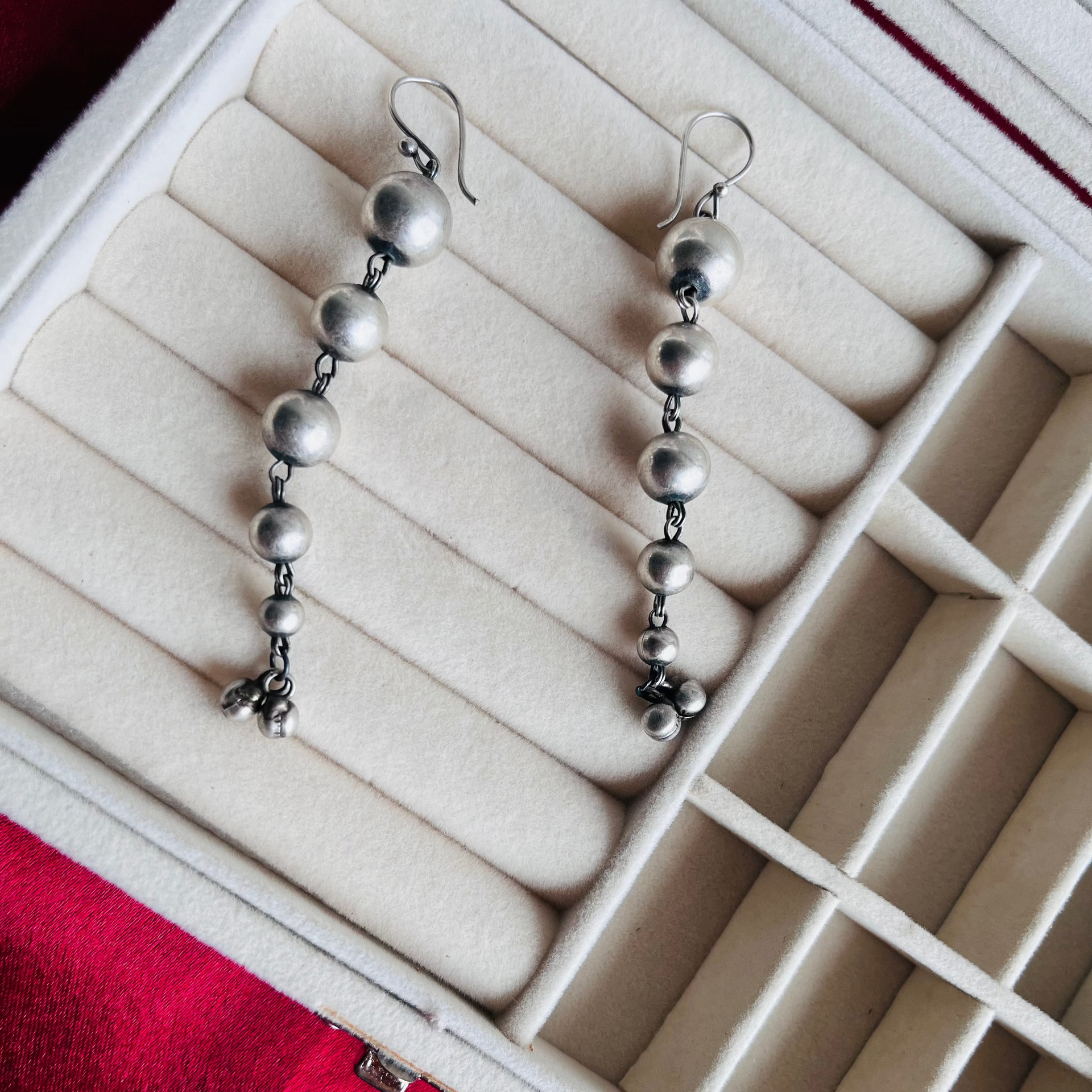 A pair of Sia Earrings with a minimal oxidized design, perfect for daily wear.