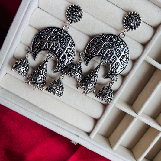 A pair of Tisha Earrings featuring intricate oxidized detailing, designed for a timeless and elegant look.